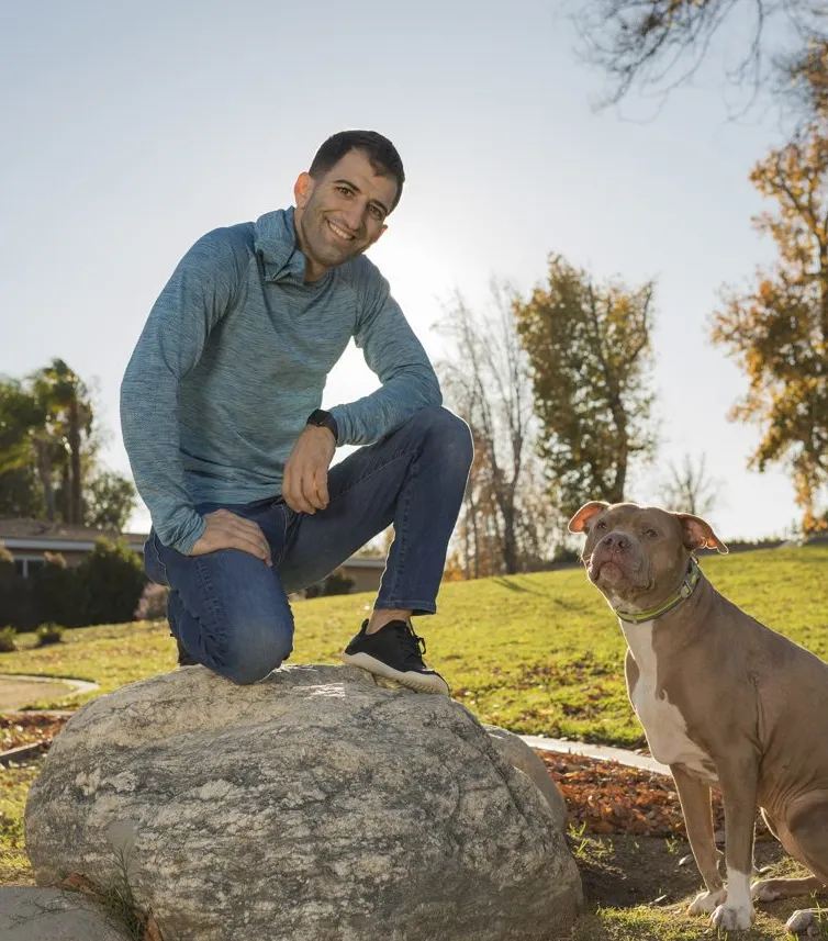 Yoni with a pit bull at a park.